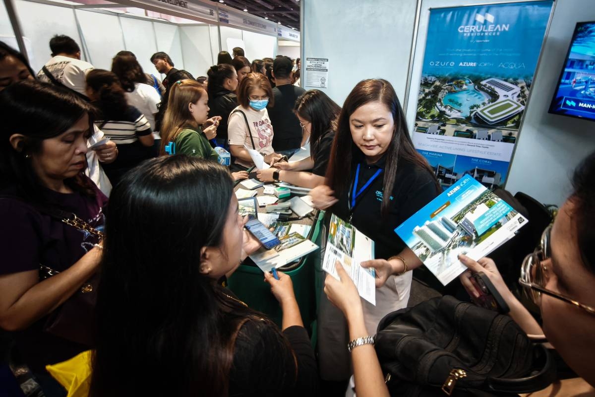 Visitors browse property displays during the 2nd National Housing Expo at the SMX Convention Center in Pasay City on Oct. 20, 2026. The two-day event, organized by the Department of Human Settlements and Urban Development (DHSUD) and Pag-IBIG Fund, showcased approximately 50,000 housing units to connect Filipino homebuyers with affordable financing options. PHOTOS BY J. GERARD SEGUIA