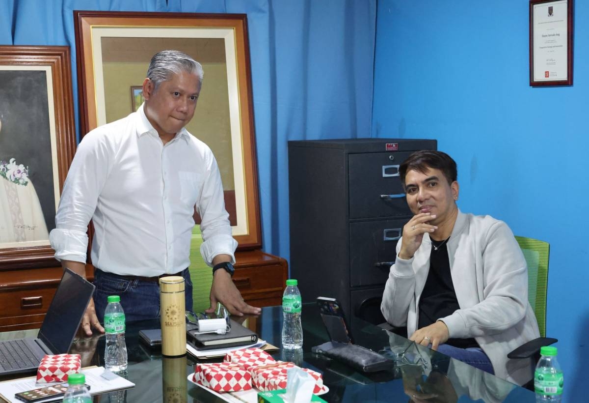 The Manila Times (TMT) Director and NewsPrime anchor Michael Alexander A. Ang welcomes The Manila Times columnist Carl Balita as he visits the TMT office in Intramuros, Manila, on Oct. 22, 2026. PHOTOS BY MIKE ALQUINTO