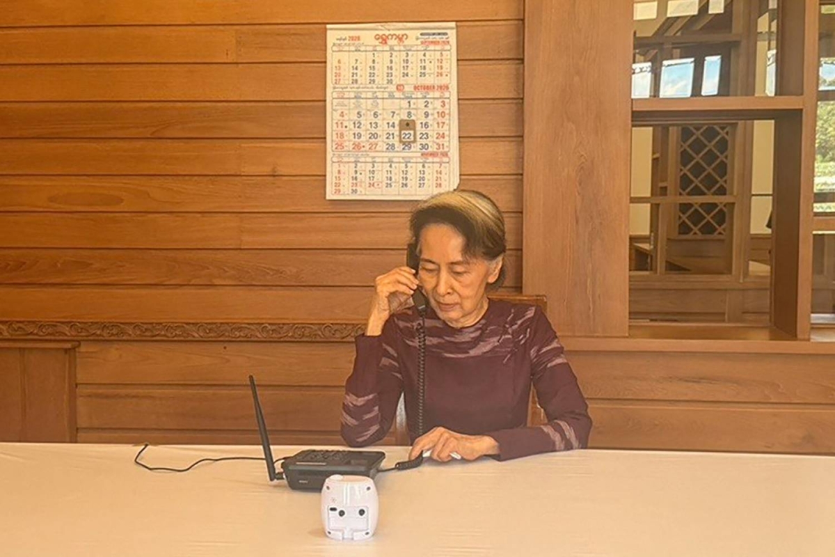 This handout photo taken and released on October 22, 2026 by Spokesperson for the President of the Republic of the Union of Myanmar shows Myanmar's ousted leader Aung San Suu Kyi speaking on the phone with her younger son Kim Aris (also known as Ko Htein Lin) in Naypyidaw. The son of Myanmar's Aung San Suu Kyi said on October 22, 2026 he was allowed to speak to the detained former democratic leader for the first time in more than five years. (Photo by Handout / Spokesperson for the President of the Republic of the Union of Myanmar / AFP) / RESTRICTED TO EDITORIAL USE - MANDATORY CREDIT "AFP PHOTO / SPOKESPERSON FOR THE PRESIDENT OF THE REPUBLIC OF THE UNION OF MYANMAR" - HANDOUT - NO MARKETING NO ADVERTISING CAMPAIGNS - DISTRIBUTED AS A SERVICE TO CLIENTS