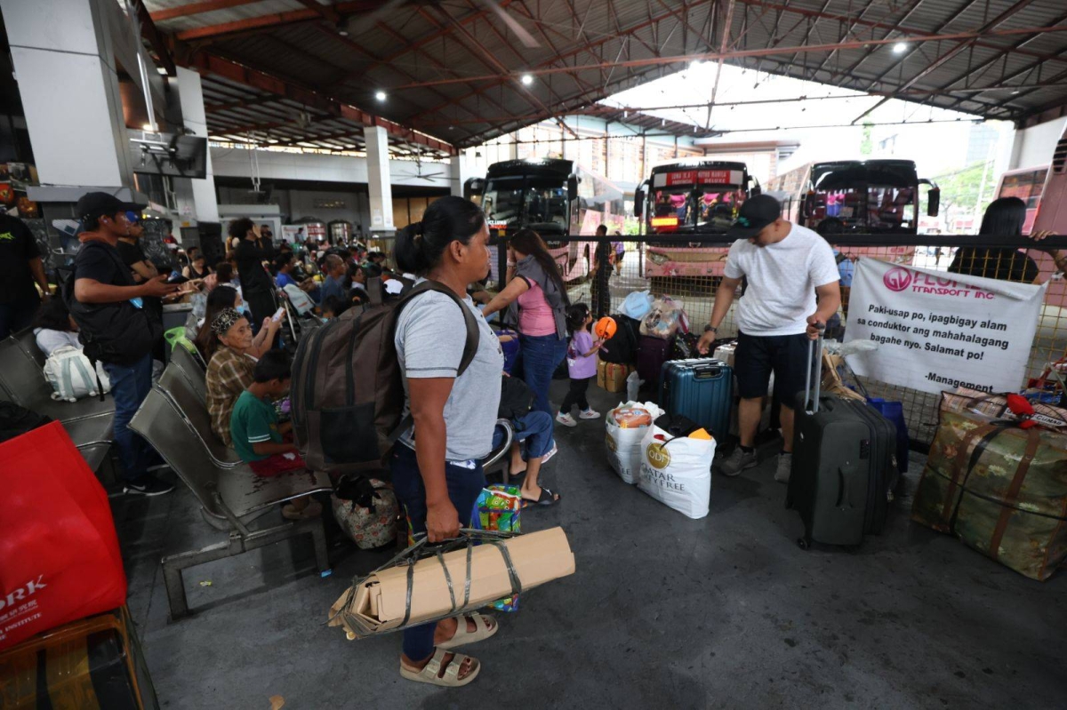 People flock to a provincial bus terminal in Manila on Oct. 30, 2026 ahead of the long weekend marked by 'Undas' or All Saints' Day and All Souls' Day on Nov. 1 and 2. On these days, Filipino families take the opportunity to bond as they remember their dearly departed. PHOTOS BY RENE H. DILAN