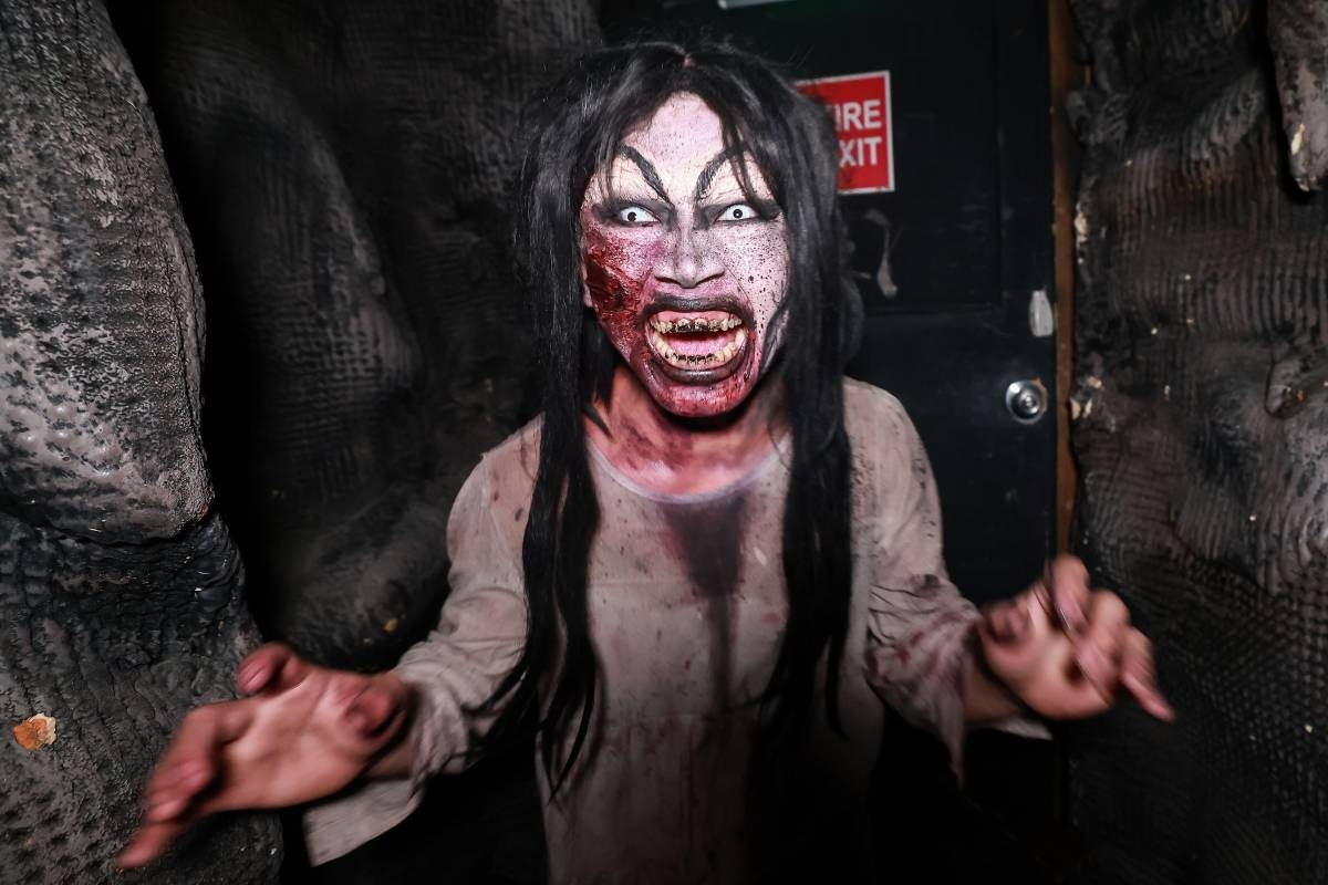 Thrill-seekers flock to Nightmares Manila in Parañaque City to brave its haunted attractions during Halloween season on Oct. 29, 2026. Visitors make their way through House of Darkness, Haunted Schoolhouse and Freakshow, reacting with screams and expressions of terror as they encounter frightening scenes inside the walkthroughs. PHOTOS BY RIO DELUVIO