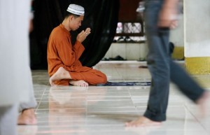 FULL FOCUS  Oblivious to the activities surrounding him, a man gets deep into prayer in a mosque in Tandang Sora, Quezon City. PHOTO BY MIGUEL DE GUZMAN