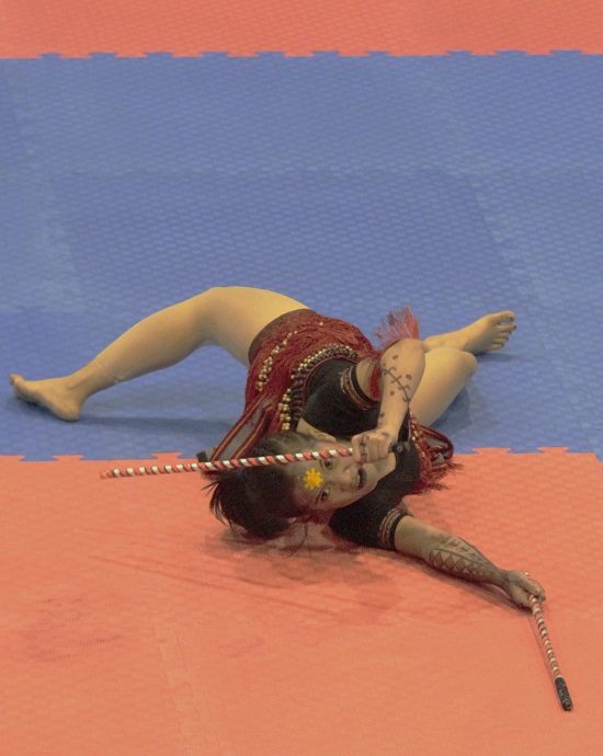 Mary Allin Aldeguer displays her winning anyo (form) in the women's open weapon forms nontraditional division of the 30th SEAG at the Angeles University Foundation. 
Photo by Roger Rañada